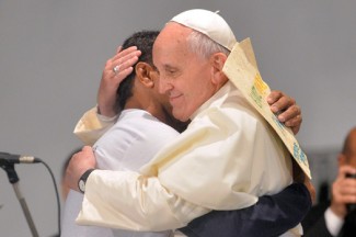 Pope Francis embraces a patient at St. Francis of Assisi Hospital in Rio de Janeiro. (CNS photo/Reuters )