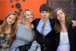 Mary Beth (second from left) and her three children. (Photo credit: Nylagray Photography)