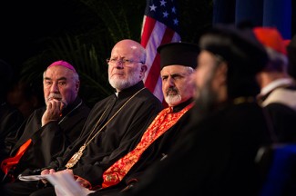 Christian leaders listen to prayer during an ecumenical summit for Middle East peace in Washington, D.C. (CNS photo/Tyler Osburn)