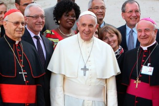 Pope Francis poses with auditors of the extraordinary Synod of Bishops on the family. (CNS photo)