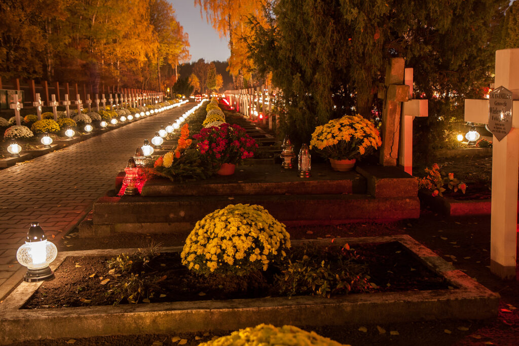 Lighted candles on graves in a Catholic cemetary in Warsaw, Poland