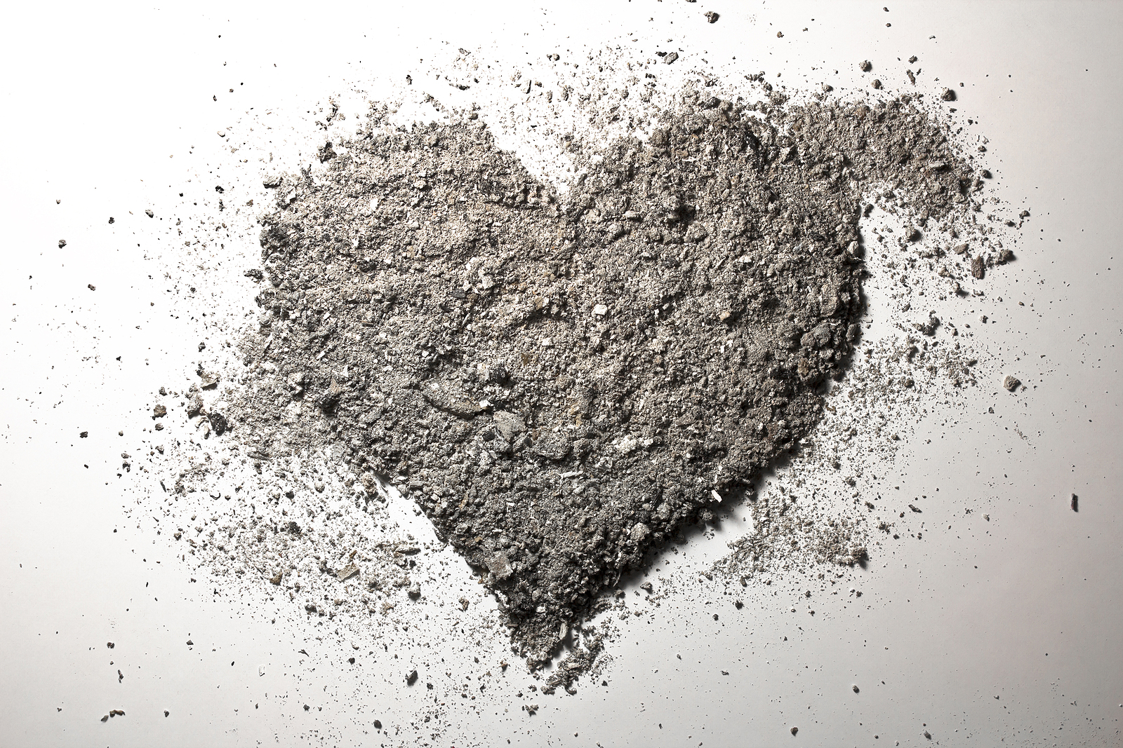 Grey heart made of ash and dust