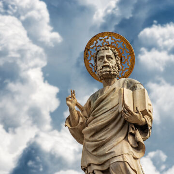 Image of statue of St. Mark with sky in background.