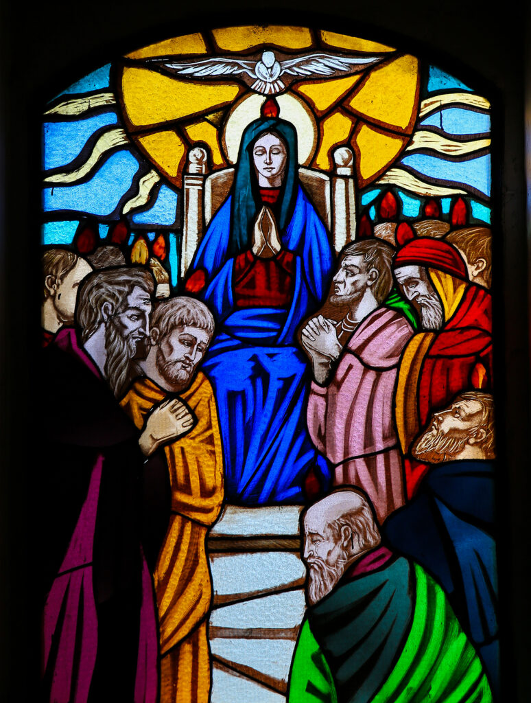 Stained glass window depicting the the Descent of the Holy Spirit at Pentecost in the Church of Ostuni Apulia Italy.